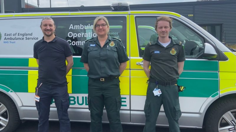 Three advanced paramedics standing in front of the mental health emergency response vehicle