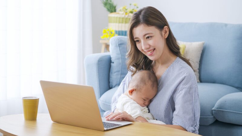 Mom,Working,On,A,Computer,At,Home
