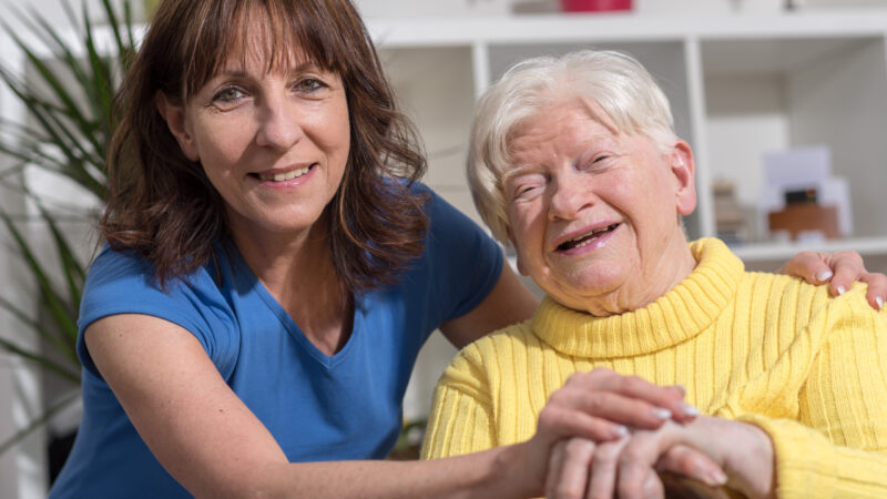 Portrait of happy grandmother with her daughter in visit