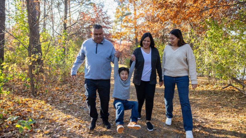 Dakota Lakota family smiles on an autumn hike