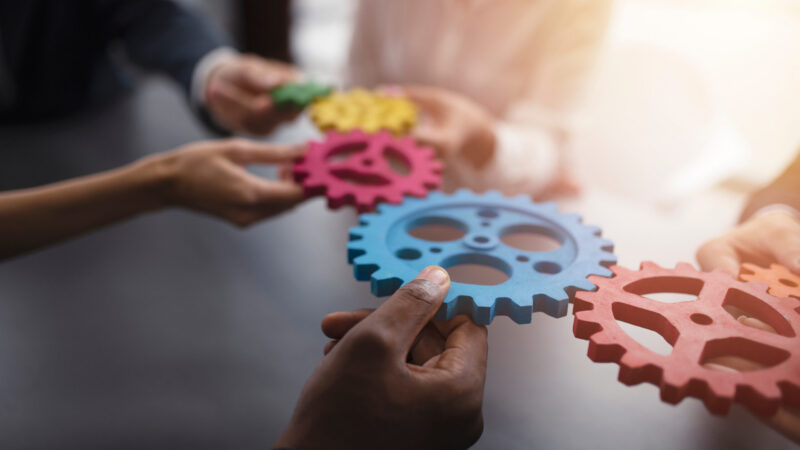 Business,Team,Connect,Pieces,Of,Gears.,Teamwork,,Partnership,And,Integration